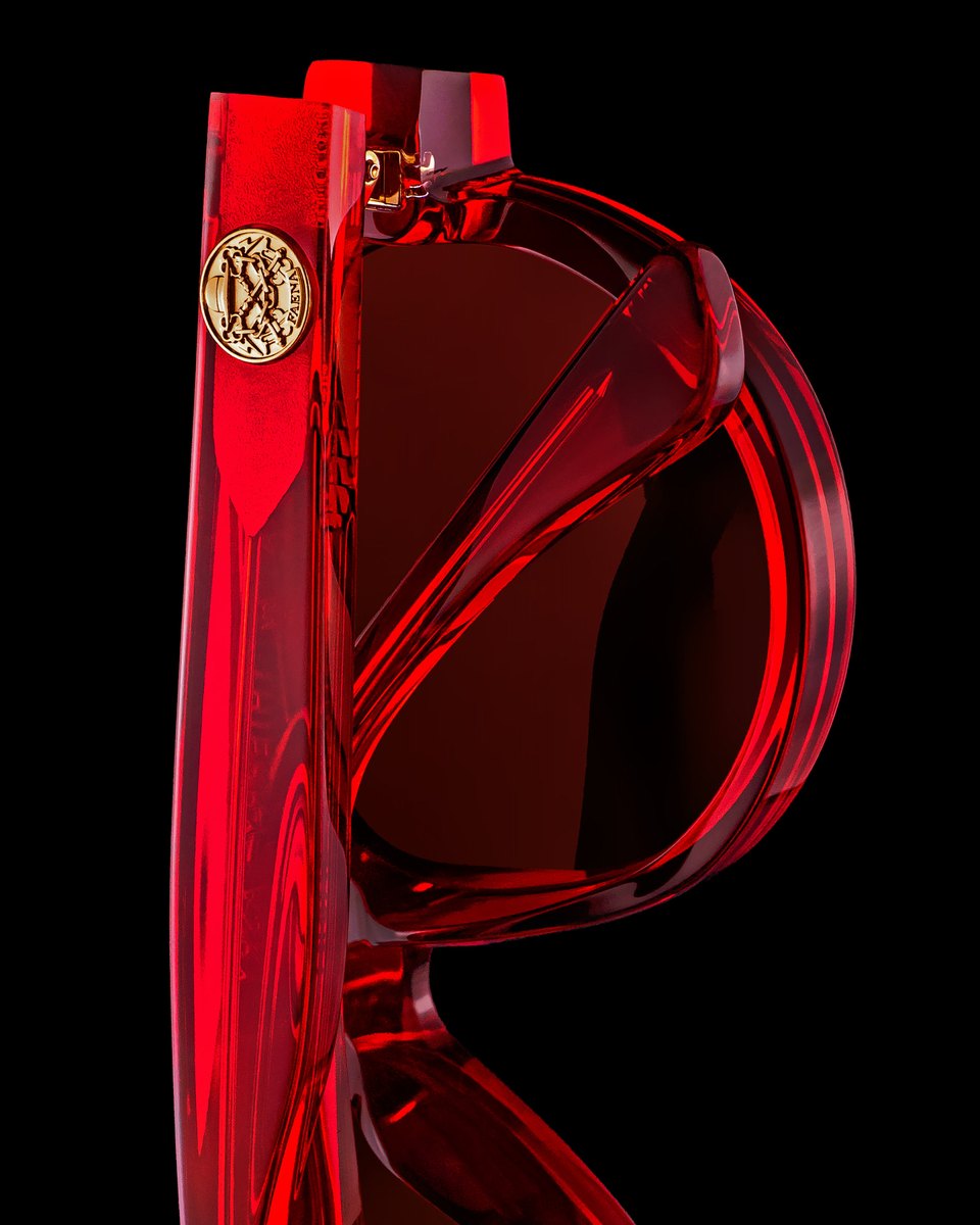 Lunettes de soleil Thierry Lasry en acétate rouge translucide sur fond noir